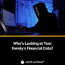 Dark room with a person in a hacker mask typing on a computer screen glowing with code. Caption reads Who’s Looking at Your Family’s Financial Data? by Asset Vantage on data privacy risks.