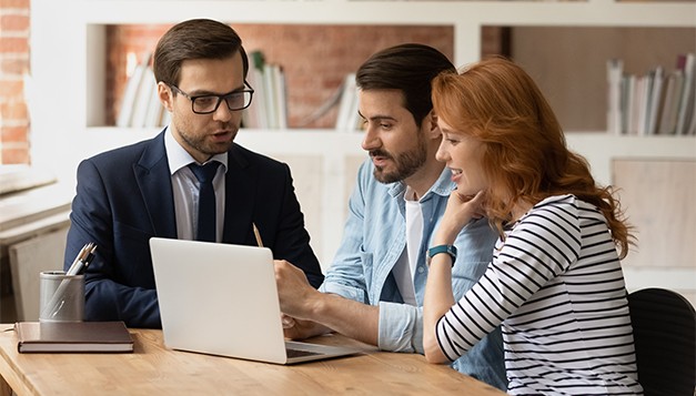 Financial advisor explains private equity investment risks and obscure data to engaged young couple, highlighting growing next-gen interest in private equity and the need for transparency