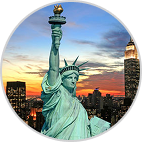 Statue of Liberty standing tall against a vibrant sunset sky with the New York City skyline behind. This iconic symbol of freedom is located in the Greater NYC Area near Liberty Island.